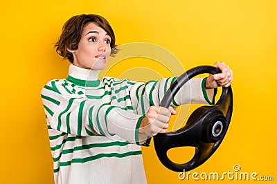 Photo of nervous girl driving first time exam missed turn unfamiliar city examination taxi license isolated on yellow Stock Photo