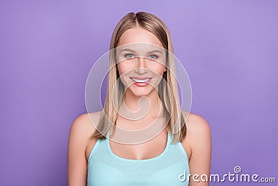 Photo of nice blond young lady wear teal top isolated on violet color background Stock Photo