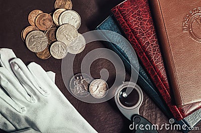 Photo of numismatist table with coins Stock Photo