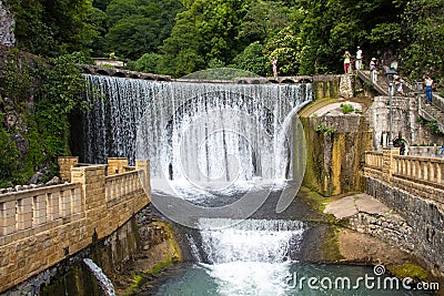 Photo of old artificial waterfall among trees Editorial Stock Photo