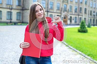 Photo of one cheerful cool confident beautiful charming pretty with toothy smile shiny lady demonstrating her knowledge and power Stock Photo
