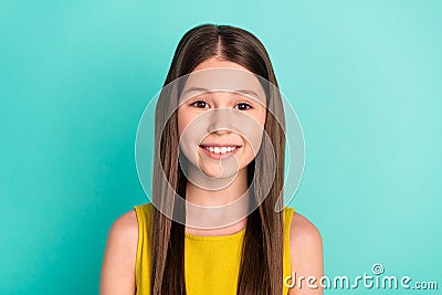 Photo of optimistic nice brown hair girl wear yellow dress isolated on bright teal color background Stock Photo