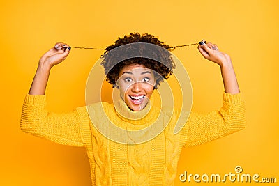 Photo of overjoyed dark skin lady showing new hairdress after visiting stylist wear warm knitted jumper isolated yellow Stock Photo