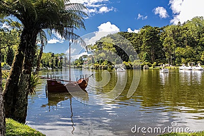 Paddle boat on the Black Lake of Gramado city, Rio Grande do Sul - Brazil, on a sunny day with sky with clouds Stock Photo