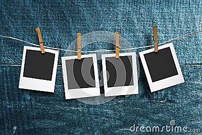 Photo paper attach to rope on wooden background Stock Photo