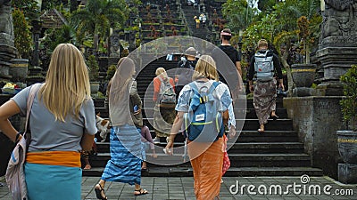 Photo of people walking on the rock stears in a sacred place with ancient stone buildings on the island of bali Editorial Stock Photo