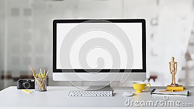 Photo of Photographer workplace. Computer monitor with white blank screen. Stock Photo