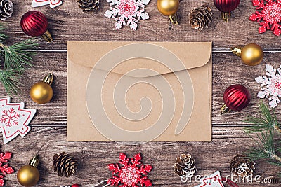 Photo picture close up of craft paper envelope and many lot of christmas accessories on brown wood desk Stock Photo