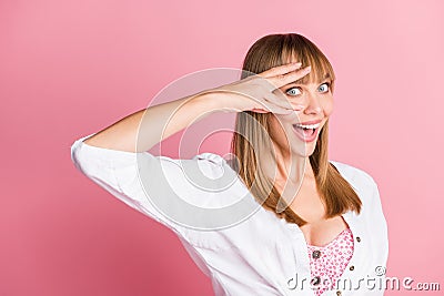 Photo of playful crazy young lady fingers cover eye excited peeking wear white blouse isolated pink color background Stock Photo