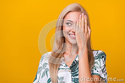 Photo of pleasant girl with long hairdo dressed shirt look at promo empty space arm close half face isolated on yellow Stock Photo