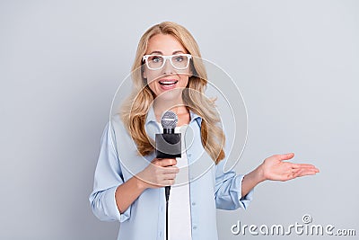 Photo of popular correspondent hold mic talk speak tell news wear specs blue shirt isolated grey color background Stock Photo