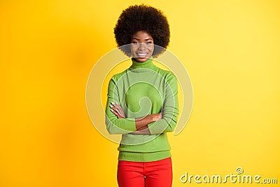 Photo portrait of african american businesswoman with crossed arms isolated on vivid yellow colored background Stock Photo