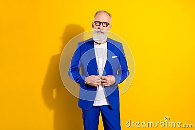 Photo portrait of businessman wearing blue tuxedo glasses serious face strict isolated on bright yellow color background Stock Photo
