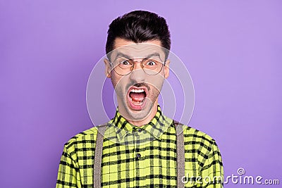 Photo portrait of enraged screaming man isolated on vivid violet colored background Stock Photo