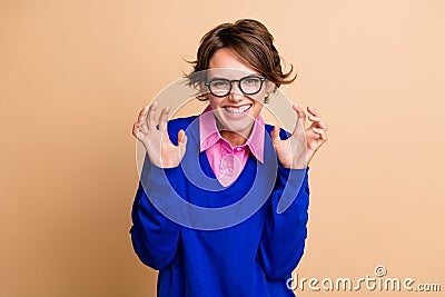 Photo portrait of pretty young girl hands claws hands gesture growl dressed stylish blue outfit isolated on beige color Stock Photo