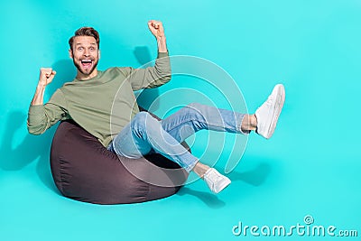 Photo of positive astonished influencer man rejoice attainment wear pullover isolated blue color background Stock Photo