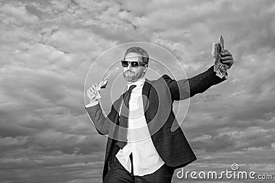 photo of positive billionaire man with money. billionaire man with money on sky background. Stock Photo