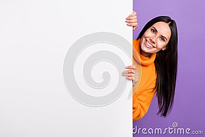 Photo of positive lady hide white billboard advertise discount message events isolated on purple color background Stock Photo