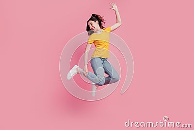 Photo of positive nice crazy brunette woman jump enjoy flight wear casual jeans clothes on pink background Stock Photo