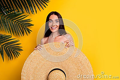 Photo of positive shocked lady wear bikini close body big sun hat empty space isolated yellow color background Stock Photo