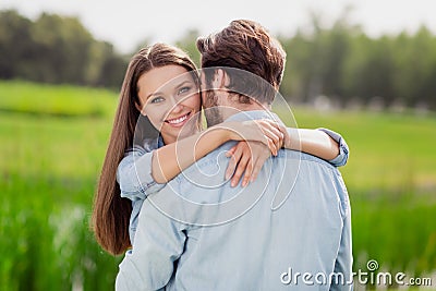 Photo of positive smiling cheerful female wife hug embrace husband enjoying honeymoon outdoors outside relaxing Stock Photo