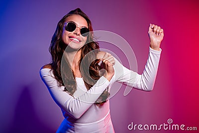 Photo of pretty clubber lady dance techno rave wear sunglass shirt isolated neon gradient color background Stock Photo