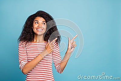 Photo of pretty dark skin lady indicating fingers empty space like sale shopping prices wear casual striped sweater Stock Photo
