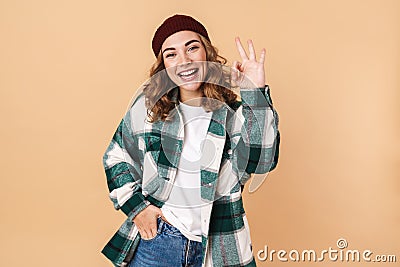 Photo of pretty joyful woman laughing and gesturing ok sign Stock Photo