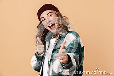 Photo of pretty joyful woman pointing fingers at camera and smiling Stock Photo