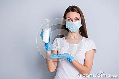Photo of pretty lady social distance avoid people contacting hold antiseptic big bottle disinfection safety concept wear Stock Photo
