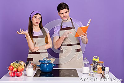 Photo of puzzled unsure boyfriend girlfriend dressed chef outfit thinking ingredients proportions isolated purple color Stock Photo