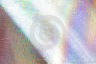 Photo of a real light rainbow crumpled holographic background with a skin texture with rays daylight Stock Photo