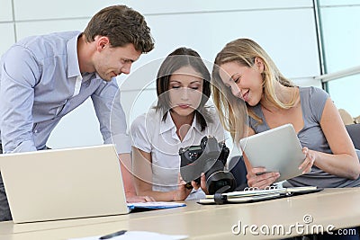 Photo reporters using digital devices Stock Photo