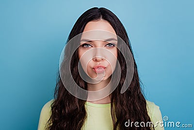 Photo of romantic affectionate girl pout lips blow air kiss look camera on blue background Stock Photo