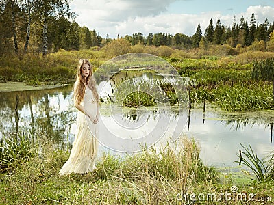 Photo of romantic woman in fairy forest Stock Photo