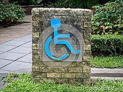 Rustic Blue Metal Handicap Sign in the Public Park Stock Photo