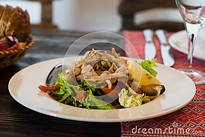 Photo salad from seafood on a white plate Stock Photo