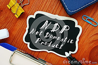 The photo says Net Domestic Product NDP. Notepad, pen, marker Stock Photo