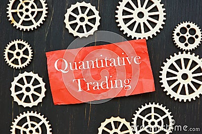 The photo says Quantitative Trading. Notepad, marker Stock Photo