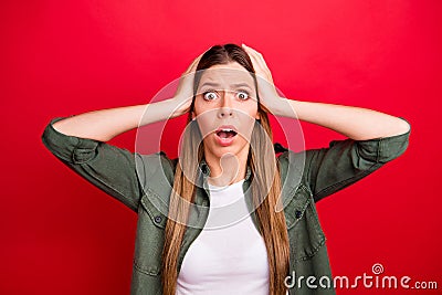 Photo of scared girl having evidently forgotten doing something while isolated with red background Stock Photo