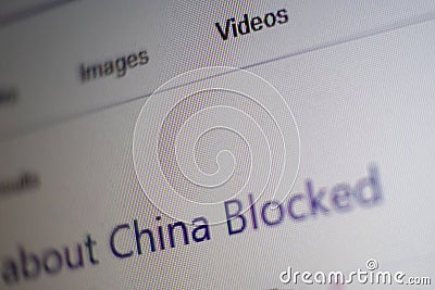 Macro. Photo screen shot of computer with text about China blocked. Selective focus. Shallow depth of field. Pixelate. Super close Stock Photo