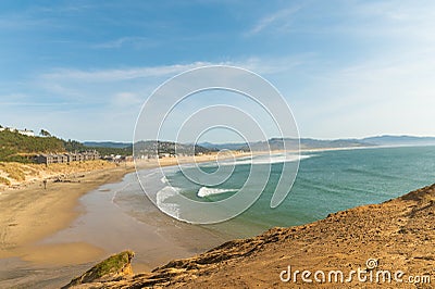 In the photo, the sea bay. The water is azure, white near the shore. Yellow sandy shores. Blue transparent sky. White clouds. Stock Photo