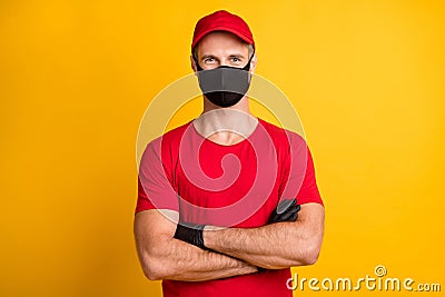 Photo of self-assured man crossed hands cool look wear mask red t-shirt hat isolated yellow color background Stock Photo