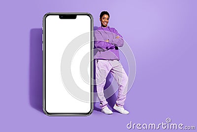 Photo of self-assured transgender person crossed hands placard blank space wear hoodie isolated purple color background Stock Photo