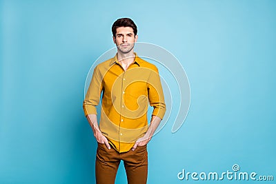 Photo of serious confident sctrict clever manager with hands in pockets of trousers staring intently at you watching Stock Photo