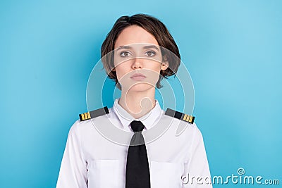 Photo of serious nice young pilot woman wear uniform calm mood isolated on pastel blue color background Stock Photo