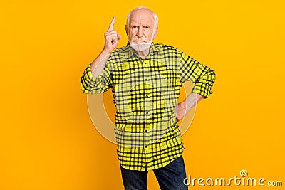 Photo of serious strict old man grandfather scold blame angry punish isolated over yellow color background Stock Photo