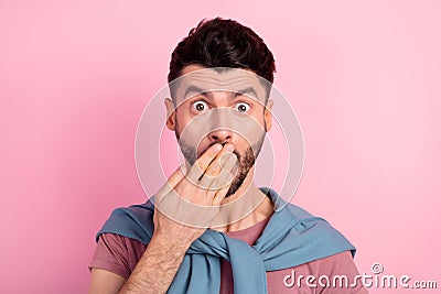 Photo of shocked guilty young man hold cover hand mouth secret mistake isolated on pink color background Stock Photo