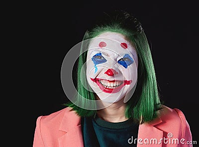 Photo shoot in the Studio on a dark background, the image of a terrible clown Stock Photo