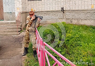 Photo shooting, photo weapons in urban environments, the photographer is hunting for a good shot Stock Photo